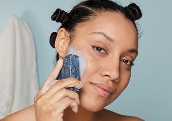 model using Pure Active Charcoal Bar on face