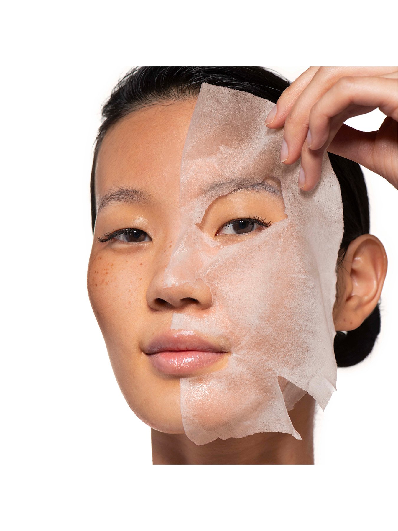 model using tissue mask on half of face